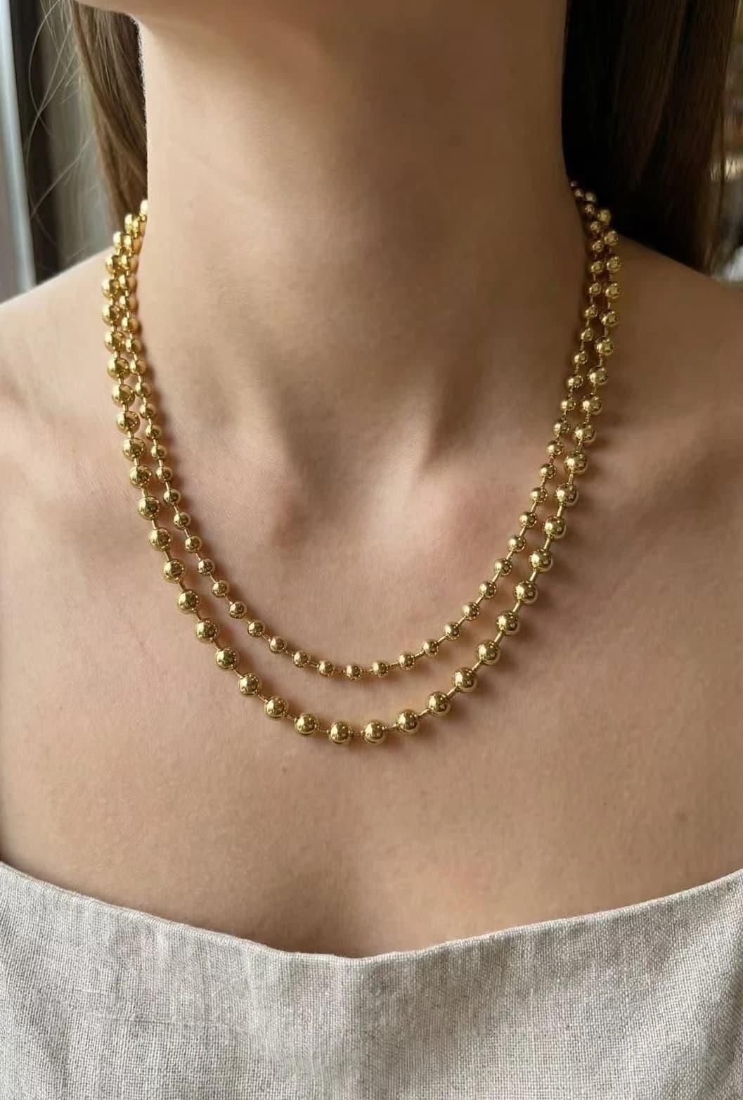 Collier double chaine petite boules